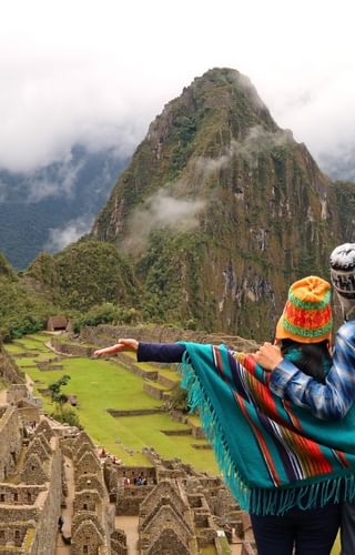 Couple admiring the spectacular view of Machu Picchu Canva Pro