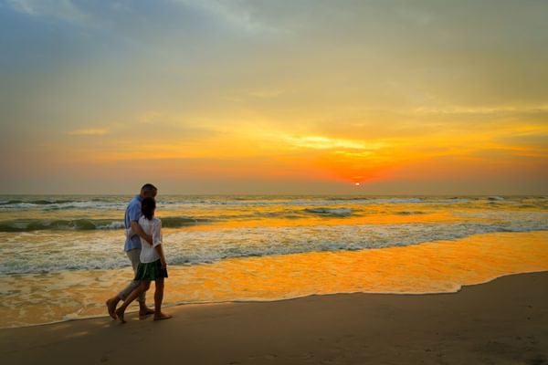 Couple walking on the beach in thailand