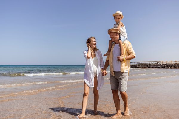 Family walking on beach cambodia canva
