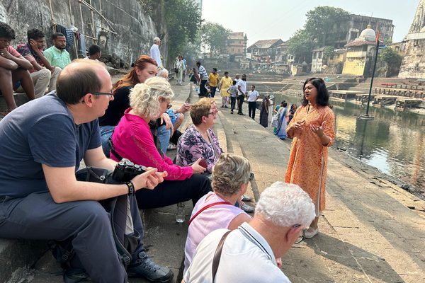 Discussing the history and heritage of the local area with our Taste Of India group.