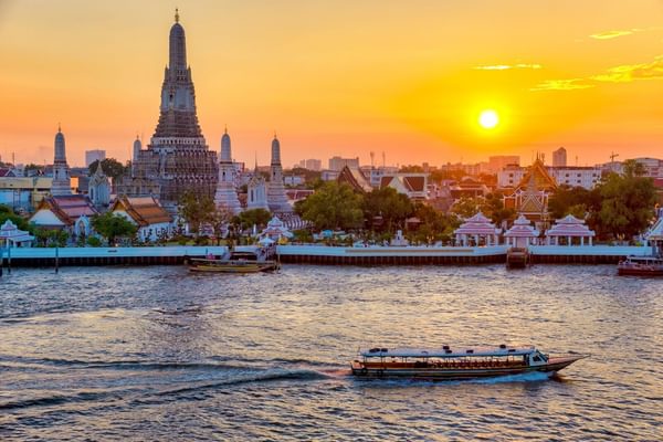 Wat Arun sunrise with riverboat Bangkok Thailand Canva Pro