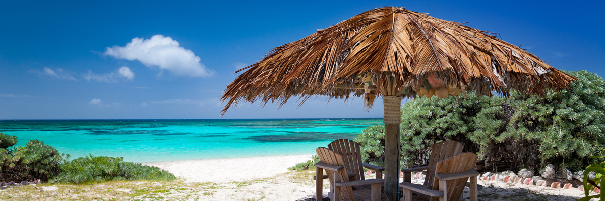 Chairs on the beach in Anegada Canva Pro